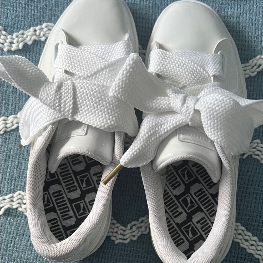 Women’s sneakers are from the Puma by Rihanna Collection size 6